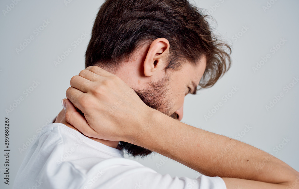 man touching his neck with his hand osteochondrosis back pain man touching his neck with his hand osteochondrosis back pain