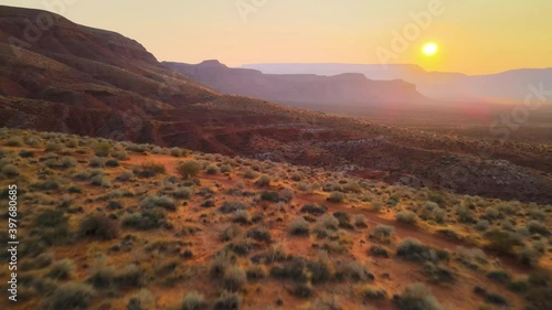 Cinematic aerial flyover of morning light in rugged desert in Southern Utah