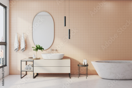 Comfortable bathroom with marble bath