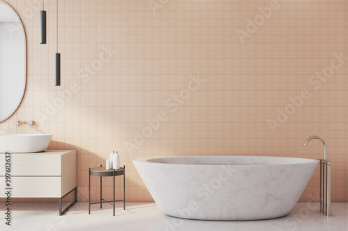Freestanding bath with mirror in modern bathroom.