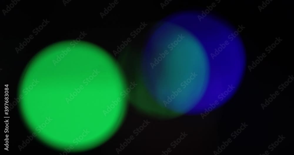 Abstract blurred background Christmas bokeh lights. Blinking multi-colored lights of garland. Christmas background on the Christmas tree. Abstract blurred background Christmas bokeh lights. Blinking multi-colored lights of garland. Christmas background on the Christmas tree.