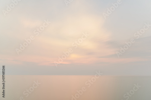 A mysterious sea landscape with blurry clouds through a long exposure time