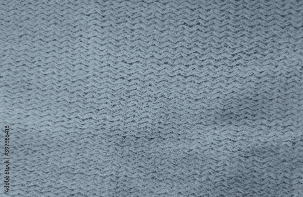 Soft cashmere texture, cosy warm cashmere sweater, scarf or blanket texture of gray color. Winter style and mood