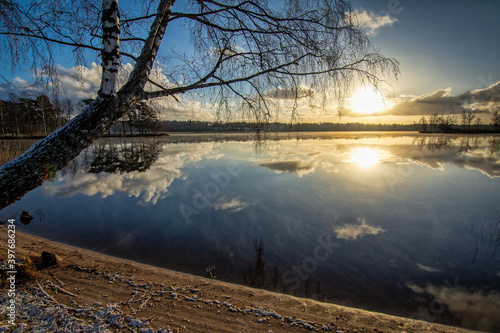 Early winter scenery with lake sunrise