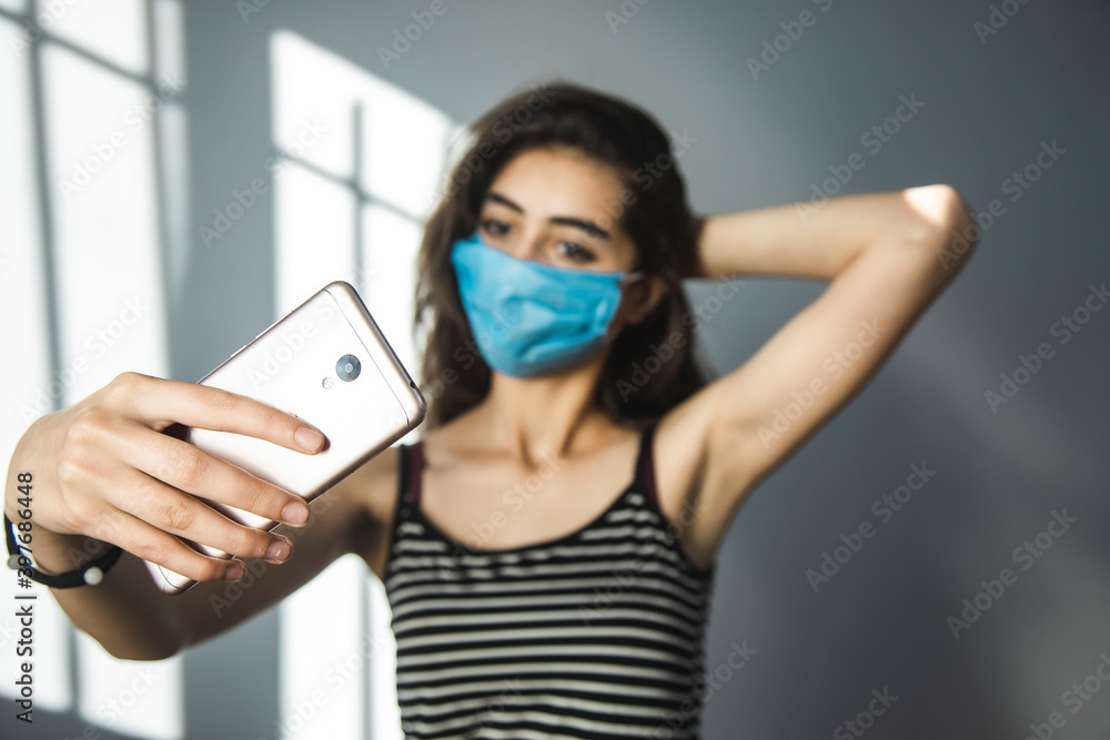 woman in mask make selfie woman in mask make selfie