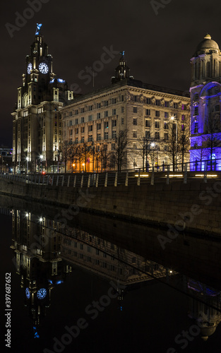 Three Graces reflect in the canal