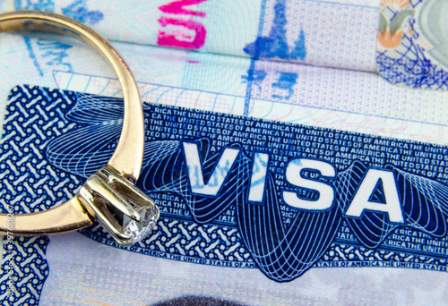 Canvas Print Engagement ring on top of blurred US entry visa sticker in a passport