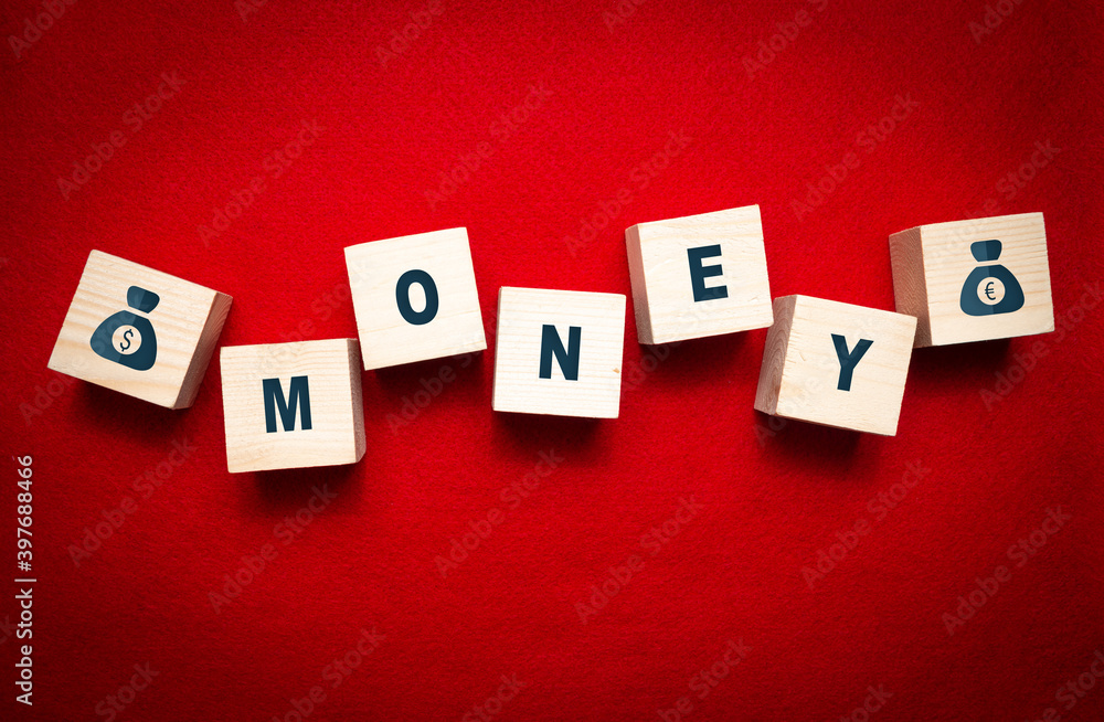 Wooden cubes with the inscription MONEY. Concept for business and earning money, running a business. Wooden cubes with the inscription MONEY. Concept for business and earning money, running a business.