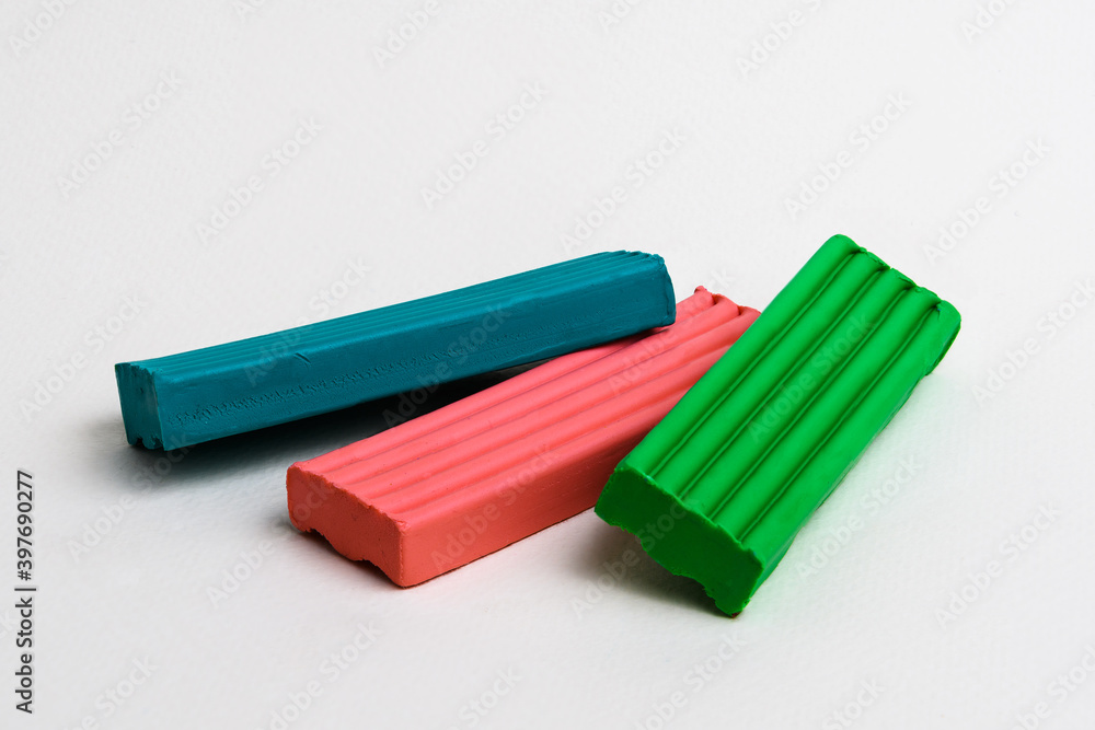 Three multi-colored bars of children's plasticine Three multi-colored bars of children's plasticine