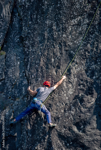 Climber on a slate quarry rock face 