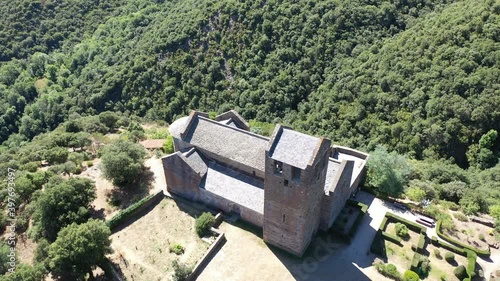 Drone view of medieval Serrabone Priory, former monastery of Canons Regular in valley of Boules at centre of Aspres mountain range, France photo