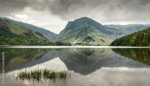 Tranquil view down Buttermere with reflected fells