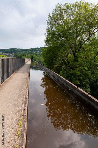Pontcysyllte Aqueduct, carries the Llangollen Canal waters across the River Dee in the Vale of Llangollen in Wales. 18-arched stone and cast iron structure is for use by narrow, canal-boats. UK