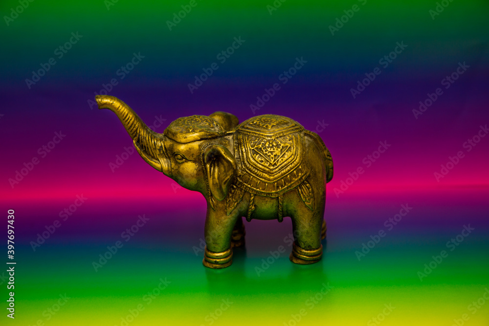 Fototapeta premium Gold elephant decoration with colorful background