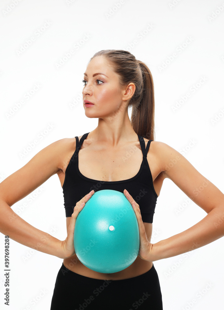 Young fit adult woman doing yoga exercise workout with gymnastics ball. Young fit adult woman doing yoga exercise workout with gymnastics ball.