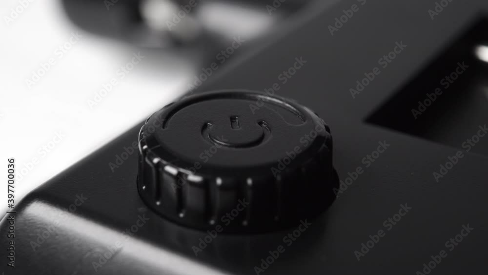 Closeup black button to adjust power and level. Macro. Dolly Shot Closeup black button to adjust power and level. Macro. Dolly Shot