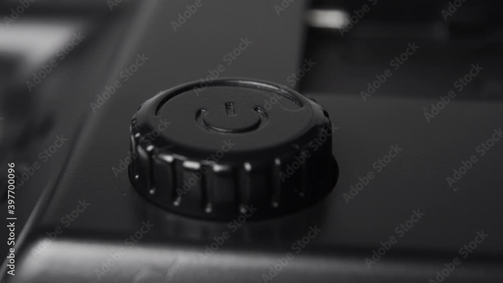 A tuning wheel for adjusting the power parameters of lighting equipment. Black plastic button. Macro. Dolly Shot A tuning wheel for adjusting the power parameters of lighting equipment. Black plastic button. Macro. Dolly Shot