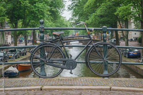 Amsterdam, bike parking over the canal in the middle of bridge