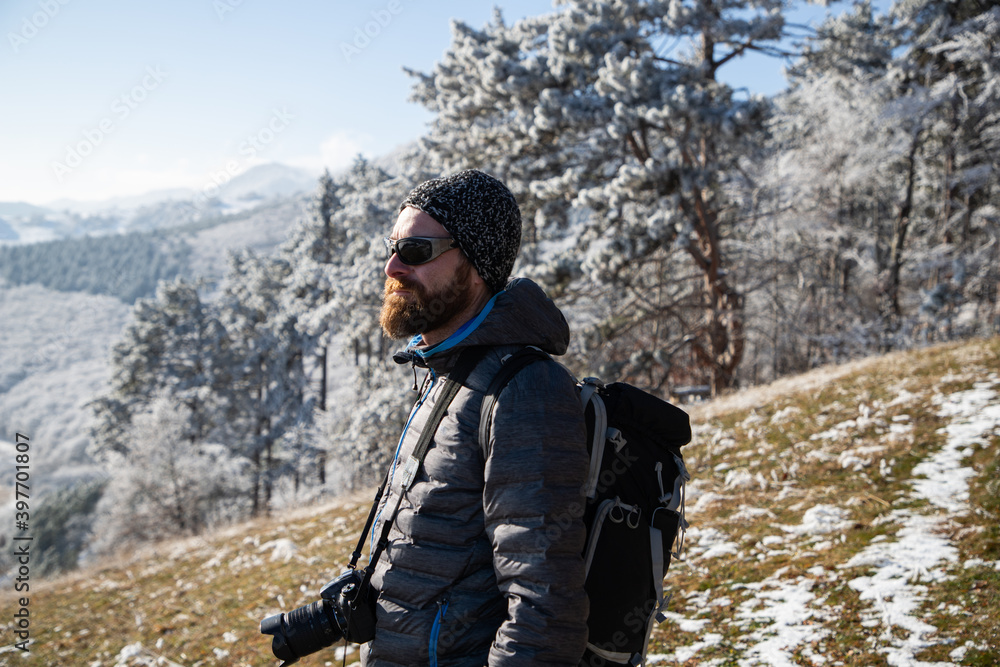 portrait of handsome man trekking in mountains in winter outdoor adventure active lifestyle and social distancing space for your text portrait of handsome man trekking in mountains in winter outdoor adventure active lifestyle and social distancing space for your text
