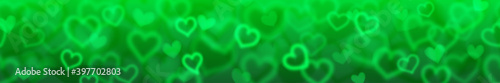 Banner with blurry hearts in green colors with horizontal seamless repetition. Valentine's day illustration