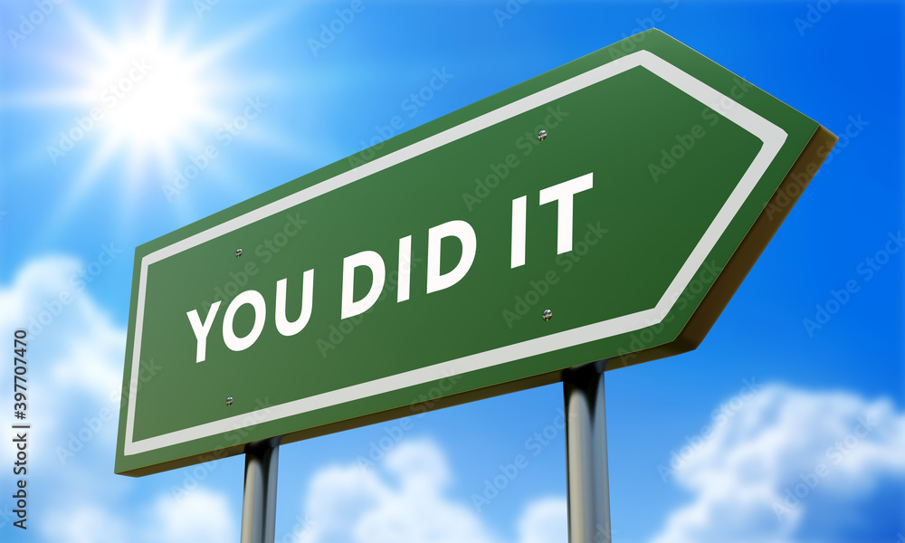 You Did It Green Road Sign Against Clouds and Sunburst. You Did It Green Road Sign Against Clouds and Sunburst.