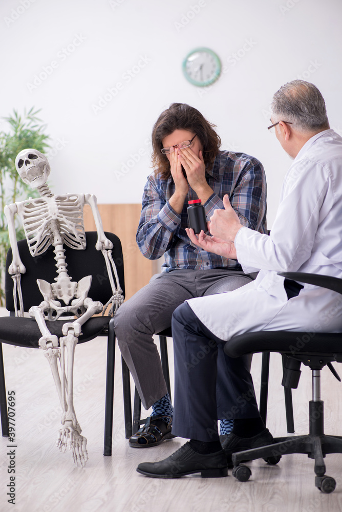 Young male patient visiting experienced doctor psychiatrist Young male patient visiting experienced doctor psychiatrist