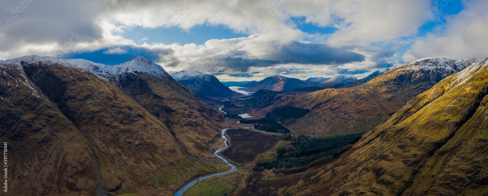 aerial view of glen etive in winter near rannoch moor in the argyll region of the highlands of scotland showing snow dusting on the mountains and munros