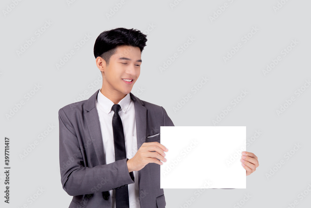 Young asian business man showing empty signboard for advertising isolated on white background, businessman confident holding billboard banner for presenting with copy space, success and achievement. Young asian business man showing empty signboard for advertising isolated on white background, businessman confident holding billboard banner for presenting with copy space, success and achievement.