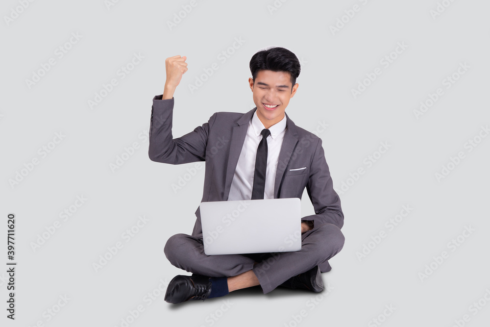 Young asian business man sitting work on laptop computer to internet online isolated on white background, businessman confident and notebook, freelance with success, marketing and communication. Young asian business man sitting work on laptop computer to internet online isolated on white background, businessman confident and notebook, freelance with success, marketing and communication.
