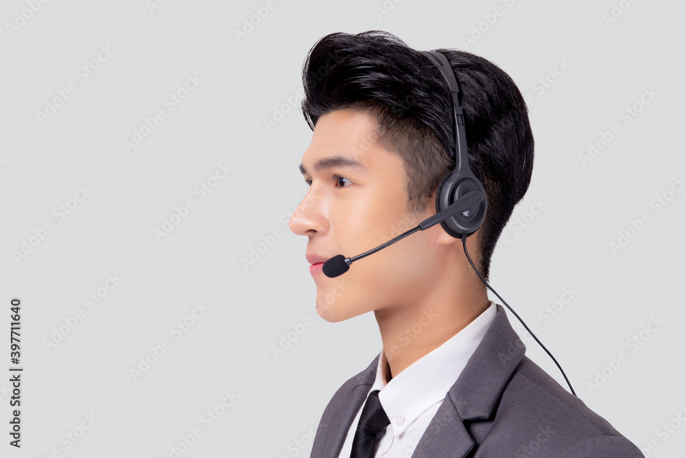 Portrait young asian business man call center wearing headset isolated on white background, agent with support and service, businessman is assistant for client with phone or helpline online. Portrait young asian business man call center wearing headset isolated on white background, agent with support and service, businessman is assistant for client with phone or helpline online.
