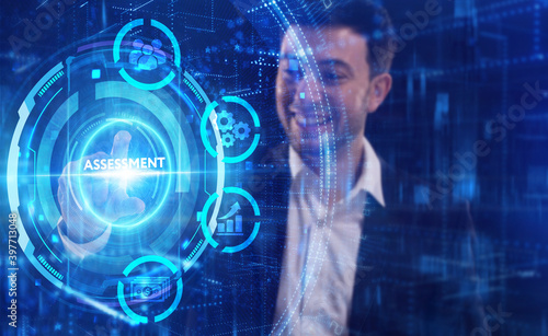 Business, Technology, Internet and network concept. Young businessman working on a virtual screen of the future and sees the inscription: Assessment