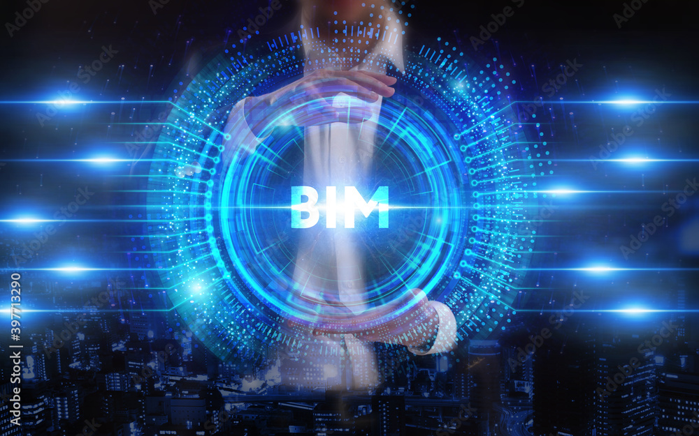 Fototapeta premium Business, Technology, Internet and network concept. Young businessman working on a virtual screen of the future and sees the inscription: BIM