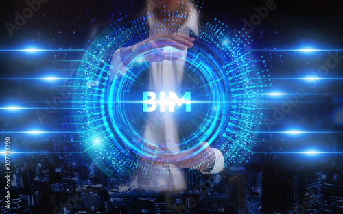 Business  Technology  Internet and network concept. Young businessman working on a virtual screen of the future and sees the inscription  BIM