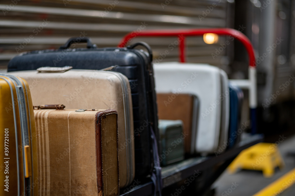 Old vintage suit cases at a train station