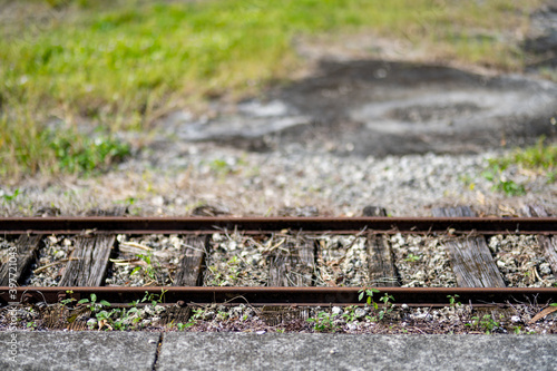 Rusted train tracks on an abandoned rail line photo