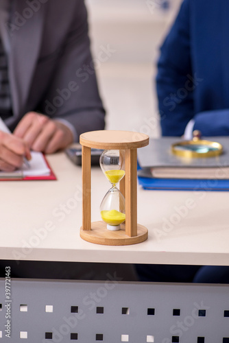 Two businessmen in time management concept