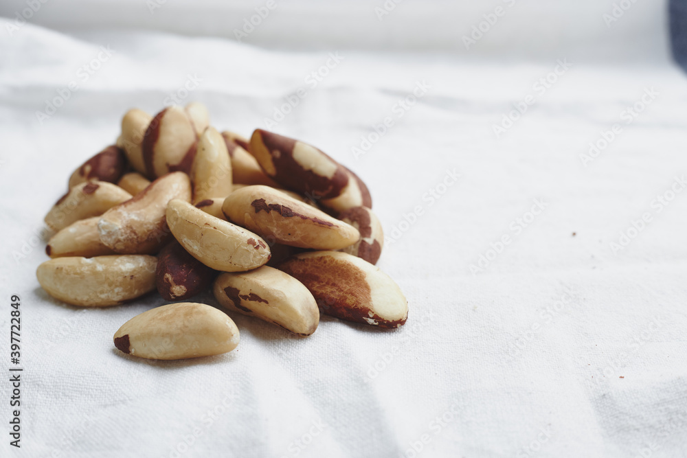 The fruit of the Brazilian nut on a white background. A bunch of vegan