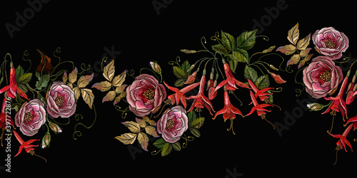 Embroidery. Buds of pink roses and red fuchsia flowers. Template for design of clothes, tapestry. Spring garden art. Horizontal seamless pattern