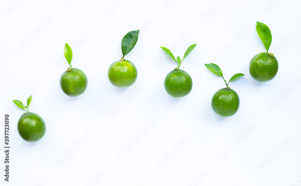 Limes with leaves isolated on white. Limes with leaves isolated on white.
