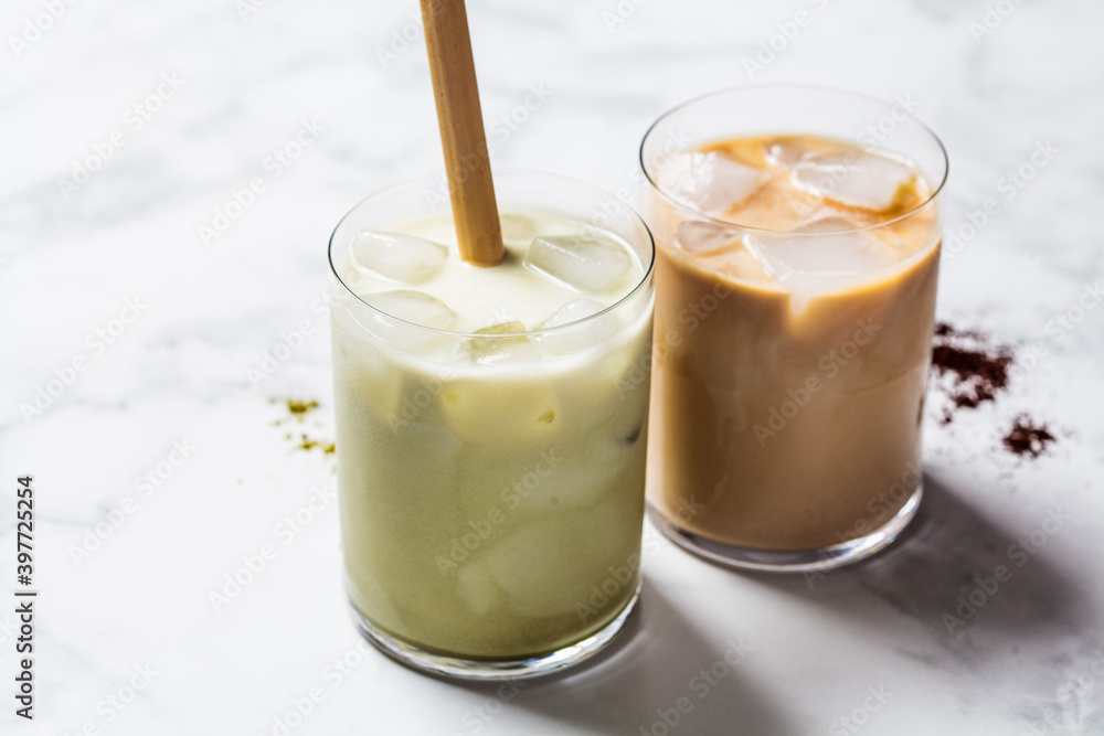Cold summer drinks concept. Ice latte matcha and ice latte coffee in glasses, white background. Cold summer drinks concept. Ice latte matcha and ice latte coffee in glasses, white background.