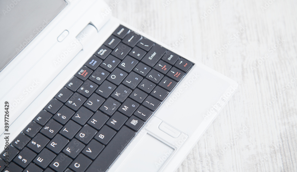 White laptop on the office desk. Technology concept White laptop on the office desk. Technology concept