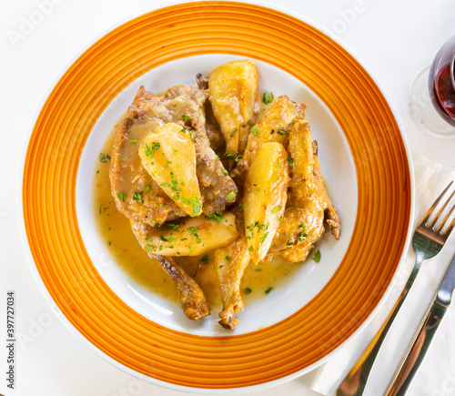 Chicken braised with pears in cava and cinnamon sauce, spanish cuisine