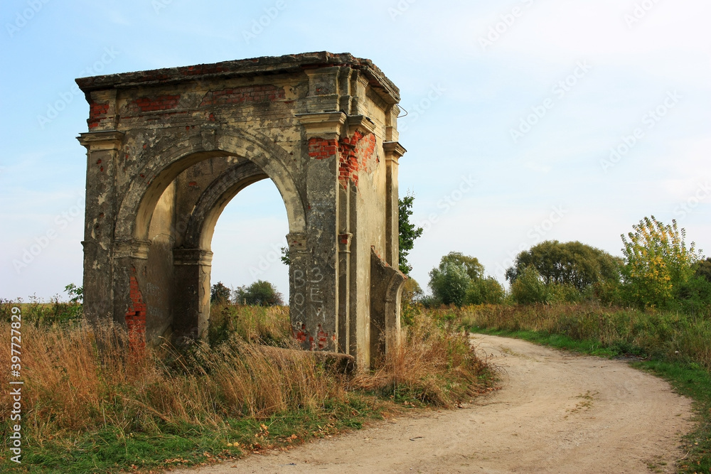 Fototapeta premium Stone dilapidated gate in an old manor