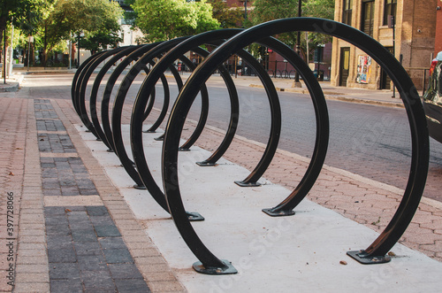 empty circular bike rack on an empty street during summer 2020 in the Exchange District in Winnipeg Manitoba, Canada