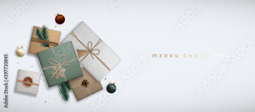 Christmas banner with top view. Flat lay composition with realistic craft gift boxes on gray background. Vector horizontal Christmas template for headers, websites, promotional backgrounds, etc.