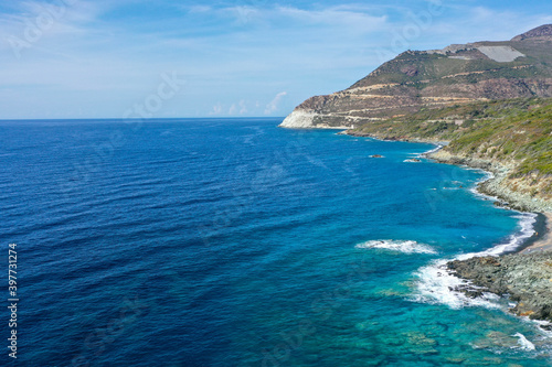 Panoramic view of the rocky coast of Corsica and across the Bay of Nonza, Cap Corse, Corsica, France