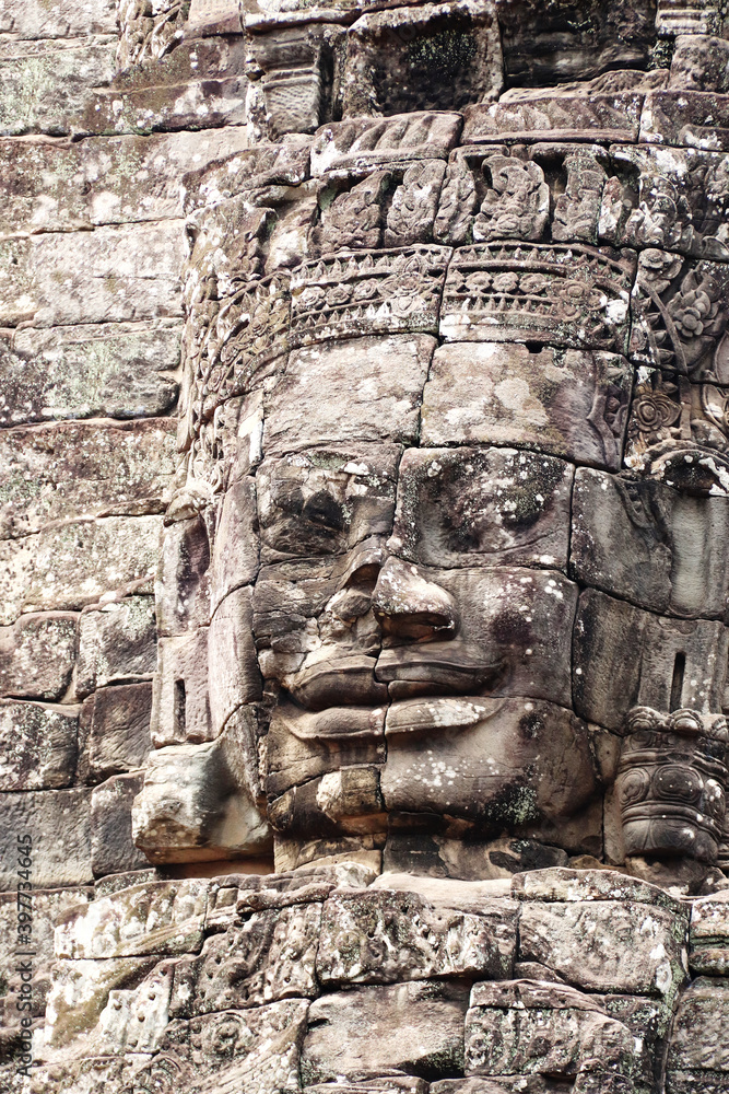 Giant stone face in Prasat Bayon Temple, Angkor Wat complex, Siem Reap, Cambodia