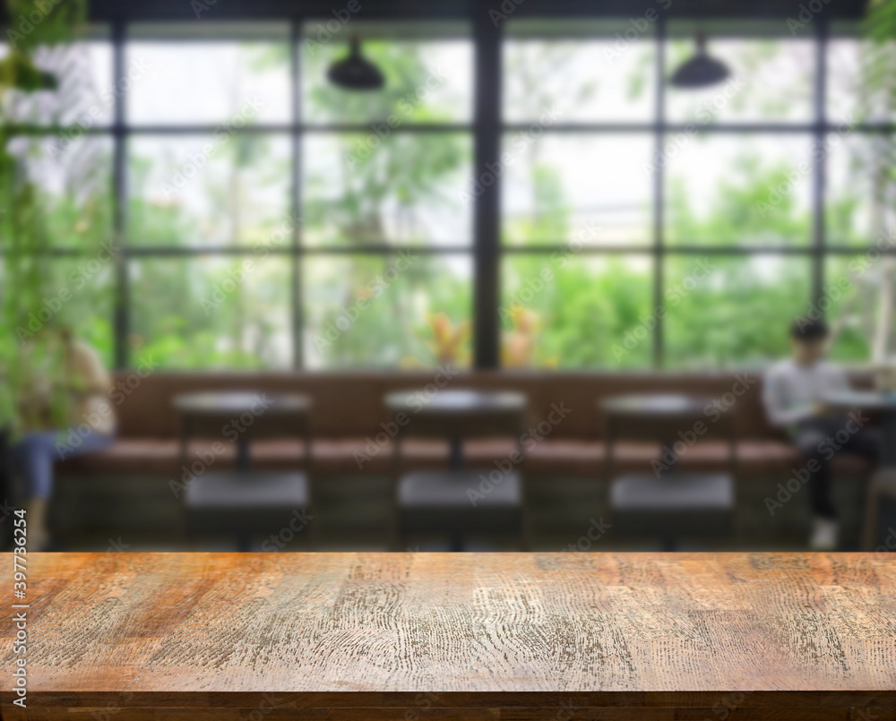 wood table top on blur cafe shop in distancing for present wood table top on blur cafe shop in distancing for present