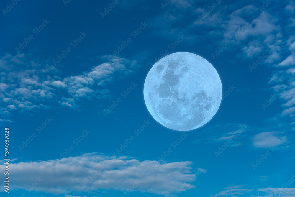 Full moon on blue sky in the morning.