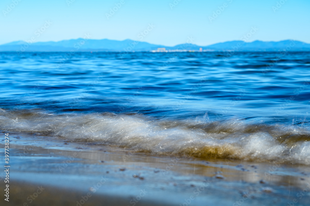 Waves on the seashore captured with a slow shutter speed. Natural abstract motion background. Waves on the seashore captured with a slow shutter speed. Natural abstract motion background.